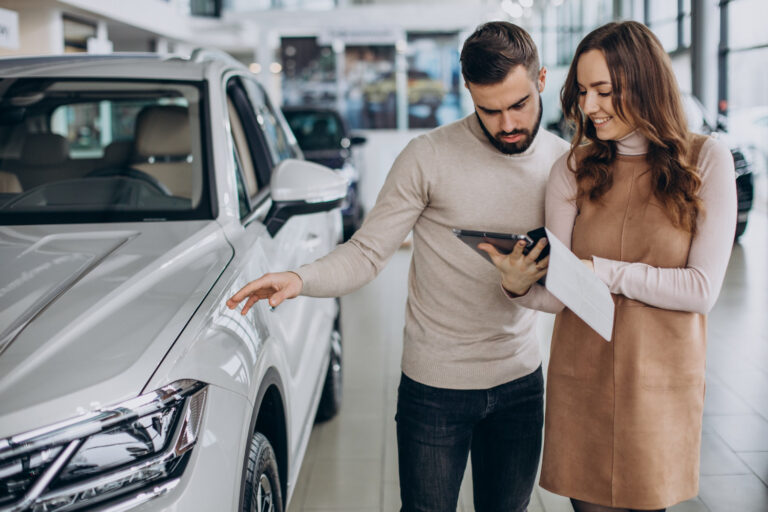A couple learning How to Get Car Financing with No Down Payment.